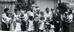 Photo of Family and friends gathered in Pacoima for the baptism of son Adam. 1963.